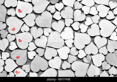 Wooden hearts, small red hearts on the heart background. Valentine day. Stock Photo