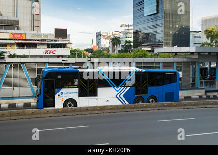 Jakarta, Indonesia - November 2017: Transjakarta bus in downtown Jakarta. Transjakarta is the first BRT (Bus Rapid Transit) system developed in SEAsia Stock Photo