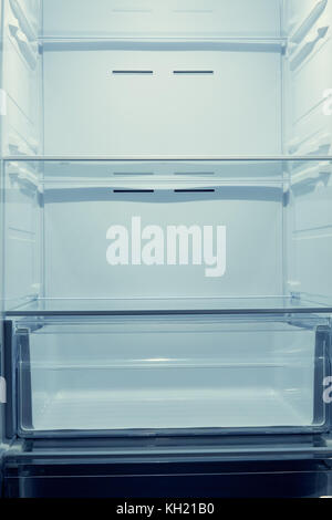 Empty shelves of a modern home refrigerator at close range Stock Photo