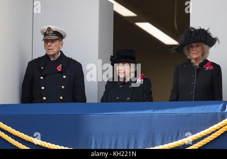 Britain's Queen Elizabeth II stands on the balcony with Britain's Prince Philip, Duke of Edinburgh and Britain's Camilla, Duchess of Cornwall during the Remembrance Sunday ceremony at the Cenotaph on Whitehall in central London, on November 12, 2017. Services are held annually across Commonwealth countries during Remembrance Day to commemorate servicemen and women who have fallen in the line of duty since World War I. Stock Photo
