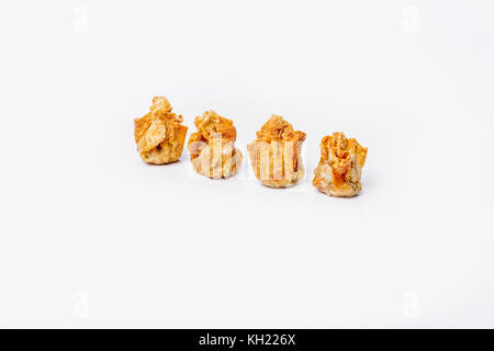 Four fried asian wonton on white background. Stock Photo