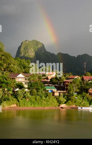 Rainbows above Nong Khiaw, Laos, in the early evening light Stock Photo