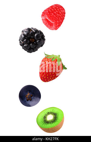 Isolated mixed fruits in the air. Falling blackberry, raspberry, blueberry, strawberry and kiwi fruits isolated on white background with clipping path Stock Photo