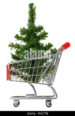 Isolated objects: toy Christmas tree in a shopping cart, on white background, seasonal shopping concept Stock Photo