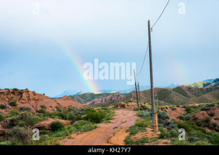 Rainbow over skazka aka fairy tale canyon, Kyrgyzstan Stock Photo