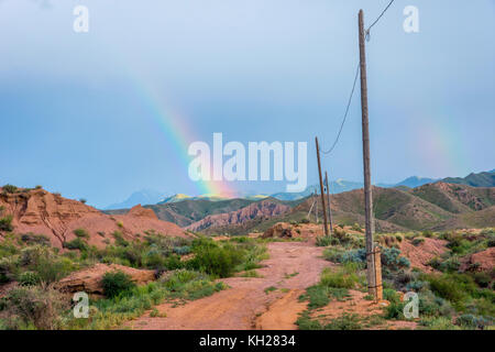 Rainbow over skazka aka fairy tale canyon, Kyrgyzstan Stock Photo