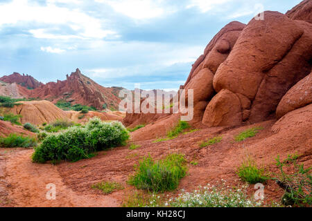 Colorful rock formations in Skazka aka Fairy tale canyon, Kyrgyzstan Stock Photo