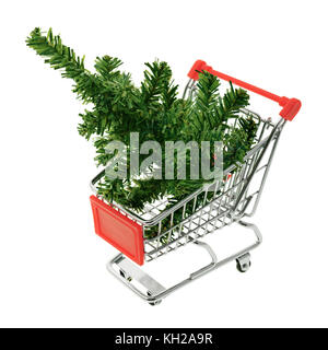 Isolated objects: toy Christmas tree in a shopping cart, on white background, seasonal shopping concept Stock Photo