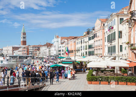 Crowds of tourists on Riva degli Schiavoni, Castello, Venice, Italy. This is where they disembark from the day trip ferries. Elevated view Stock Photo