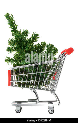 Isolated objects: toy Christmas tree in a shopping cart, on white background, seasonal shopping concept Stock Photo