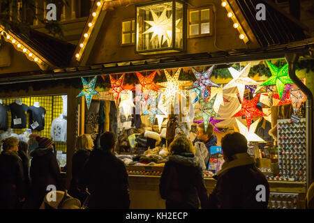 Manchester Christmas Market in St Annes Square, Manchester UK on 11 Nov 2017  A stall sellings large light stars. Stock Photo
