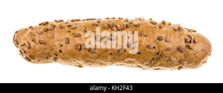 Wholegrain bread roll sprinkled with sunflower seeds. Baked crunchy loaf of brown bread isolated on white background. Stock Photo