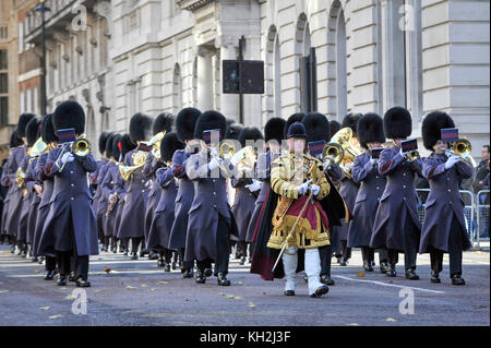 London, UK.  12 November 2017. Queen's Guard band parades in Birdcage Walk.  Large crowds gather around Parliament Square and Whitehall on Remembrance Sunday where members of the Royal Family, dignatories and veterans gave tributes to war dead at The Cenotaph.  Credit: Stephen Chung / Alamy Live News Stock Photo