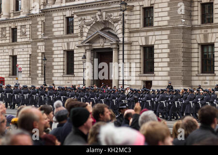 London, London, UK. 12th Nov, 2017. The crowd watches solemnly and photographs as the army marches past.Hundreds of Londoners gather at Whitehall on remembrance day to pay tribute to those who have suffered or died at war. Credit: Belinda Jiao/SOPA/ZUMA Wire/Alamy Live News Stock Photo