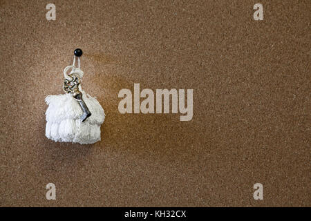 old key on a cork board Stock Photo