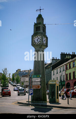 Clock tower and an old phone booth standing in the centre of Westport town, county Mayo, Ireland Stock Photo