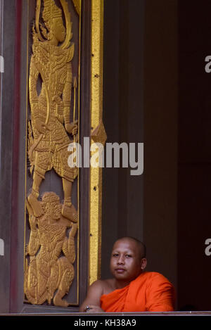 Buddhist Mont at the window of monastery Vientiane Laos Stock Photo