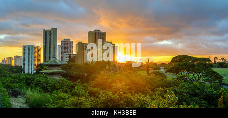 Sunset at Waikiki over the skyline in Oahu, Hawaii. Stock Photo