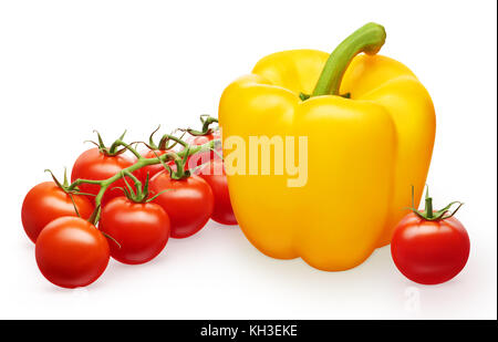 Whole fresh yellow bell pepper, branch of red cherry tomatoes with green leaves and single tomato isolated on white background Stock Photo