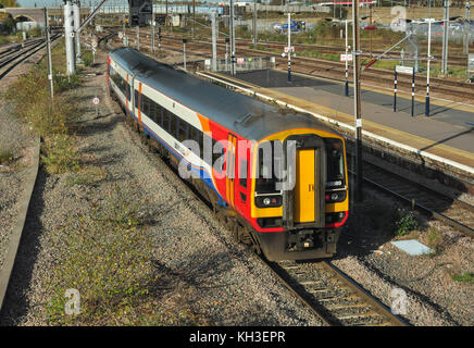 East Midlands Trains Class 158 heading north from the station at Peterborough, Cambridgeshire, England, UK Stock Photo