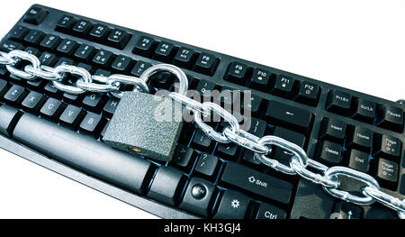 Secured computer keyboard, cyberattacks protection metaphor Stock Photo