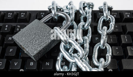 Padlock chain protected computer keyboard Stock Photo