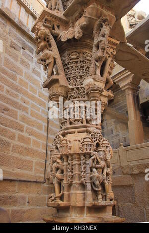 Intricately carved red marble pillar at Jain Temple in Jaisalmer Fort, Jaisalmer, Rajasthan, India, Asia Stock Photo