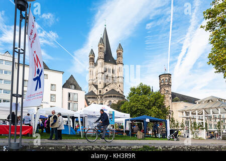 COLOGNE, GERMANY - SEPTEMBER 17, 2017: people on street market in Frankenwerft area of Cologne. Cologne is fourth populated city in Germany, it is loc Stock Photo