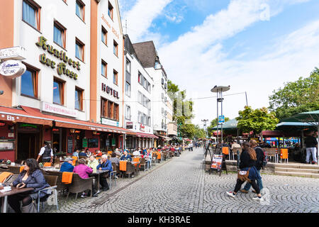COLOGNE, GERMANY - SEPTEMBER 17, 2017: peope in outdoor cafe on Am Bollwerk promenade in Cologne. Cologne is fourth populated city in Germany, it is l Stock Photo
