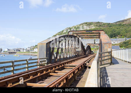 The railway bridge with public footpath in Barmouth, Gwynedd, Wales UK Stock Photo