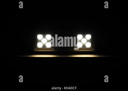 Two LED lights on the dark wooden ceiling, technology background Stock Photo