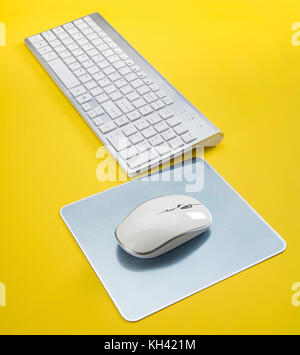 Computer Keyboard and mouse set on Yellow Stock Photo
