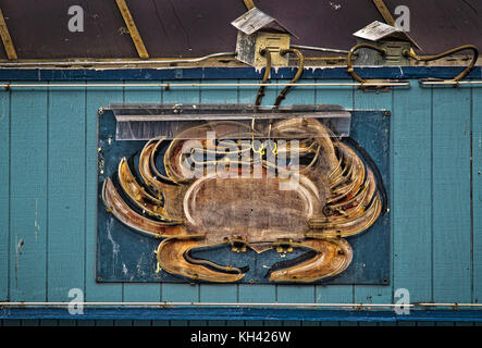 neon crab sign on a restaurant at San Francisco port area Stock Photo