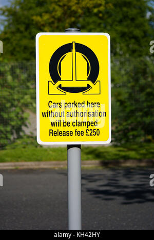 Wheel clamping sign showing a release penalty of £250 in the UK Stock Photo