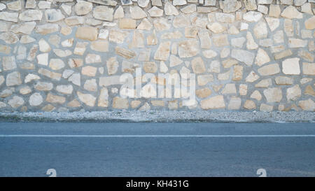 Stone wall and sidewalk, background scenes Stock Photo