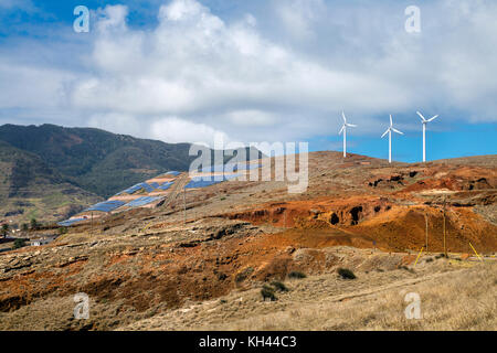 Green energy - solar panels and wind turbines installed on a hillside in Canical / Prainha, Madeira, Portugal Stock Photo
