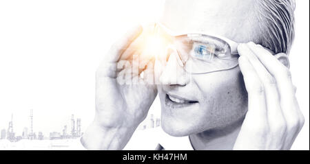 Industry 4.0 , Smart engineering and augmented reality glasses equipment technology concept. Engineer using glasses for monitoring status of machine a Stock Photo