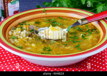 Home cooked rice soup with pork meat and potato. Healthy food. Lunch concept Stock Photo