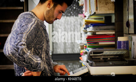 Man using photocopier Stock Photo