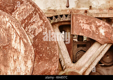 Rusted machinery detail in warm tone. Grunge background Stock Photo