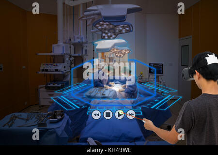Smart medical technology concept, Medical student use augmented reality technology in operation room for learning the surgery patient , in 3d , it can Stock Photo