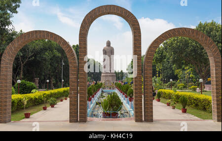 Gigantic sculpture of standing Buddha 80 feet tall at Wat Thai monastery Sarnath, Varanasi, India. Stock Photo