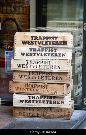 Brussels, Belgium - April 2015: Empty wooden crate of Belgian beer in front of liquor store in Brussels, Belgium Stock Photo