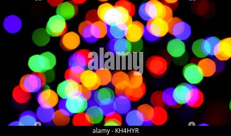 Colorful blurred bokeh lights on black background. Stock Photo