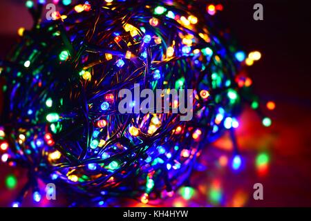 Closeup of a tangled multi color led string Stock Photo