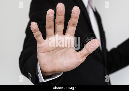 Businessman scan fingerprints for bio metric identity approval on screen. Network security system concept Stock Photo