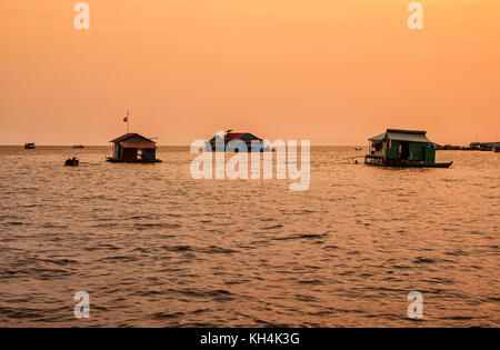 Vietnamese floating village on Lake Tonle Sap in the evening at sunset, Cambodia Stock Photo