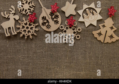 Christmas wooden figures on canvas background Stock Photo