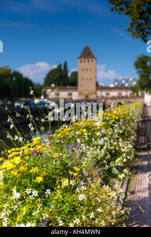 Medieval bridge Ponts Couverts in Strasbourg behind the flower decoration. Stock Photo
