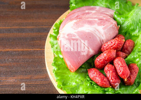 Assorted meat products including ham and sausages Stock Photo